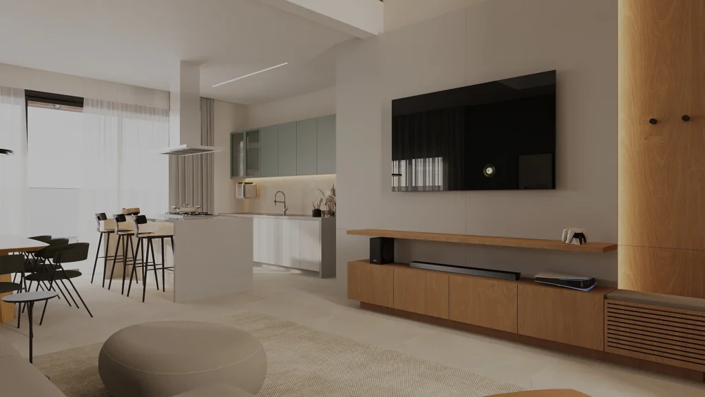 Sala de estar integrada, com painel de madeira, televisão e vista para a cozinha ao fundo